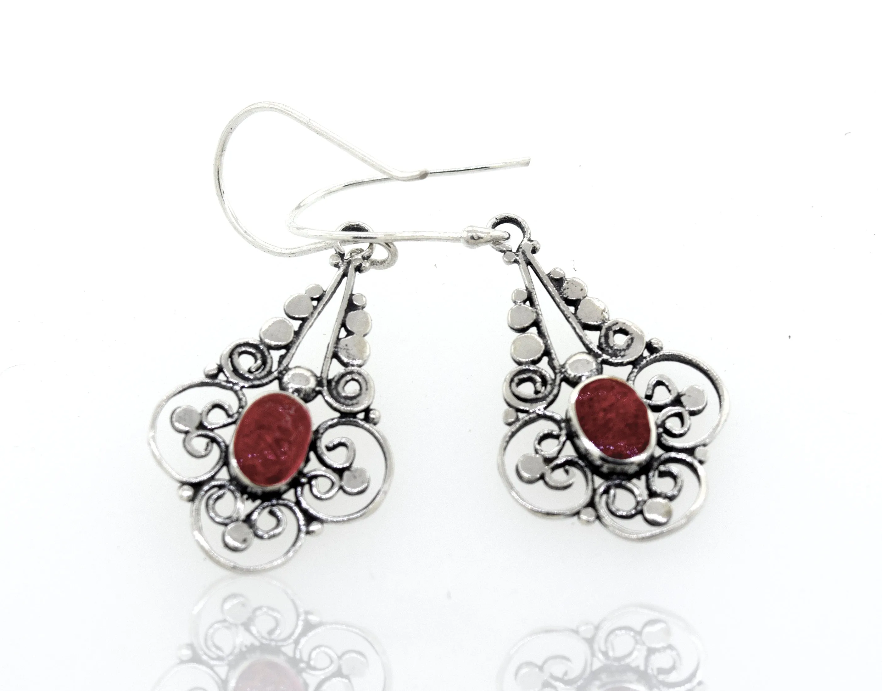 Oval Coral Dangle Earrings With A Flower Design