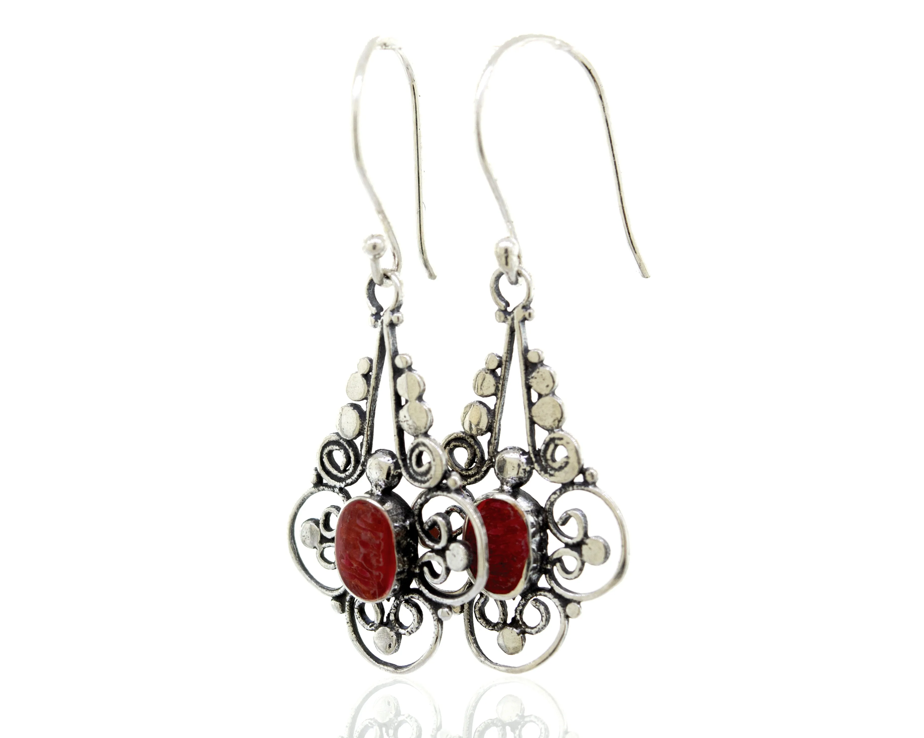 Oval Coral Dangle Earrings With A Flower Design